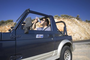 Man Drinking Cold Water in Car