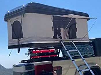 Hardtop Tent Mounted on Bed of Pickup Truck